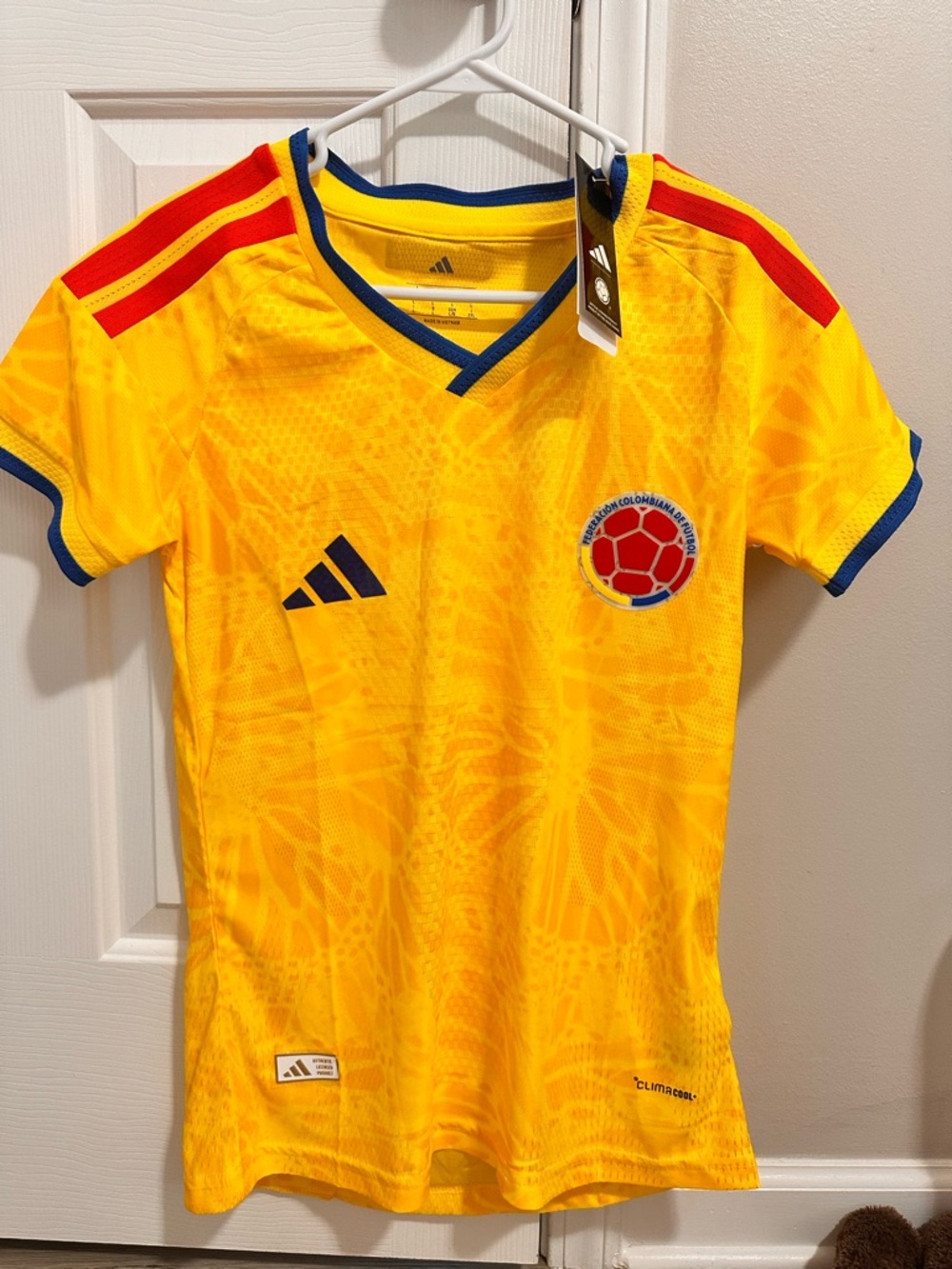 Women adidas Kids Colombia Yellow Soccer Jersey with Blue & Red Accents.